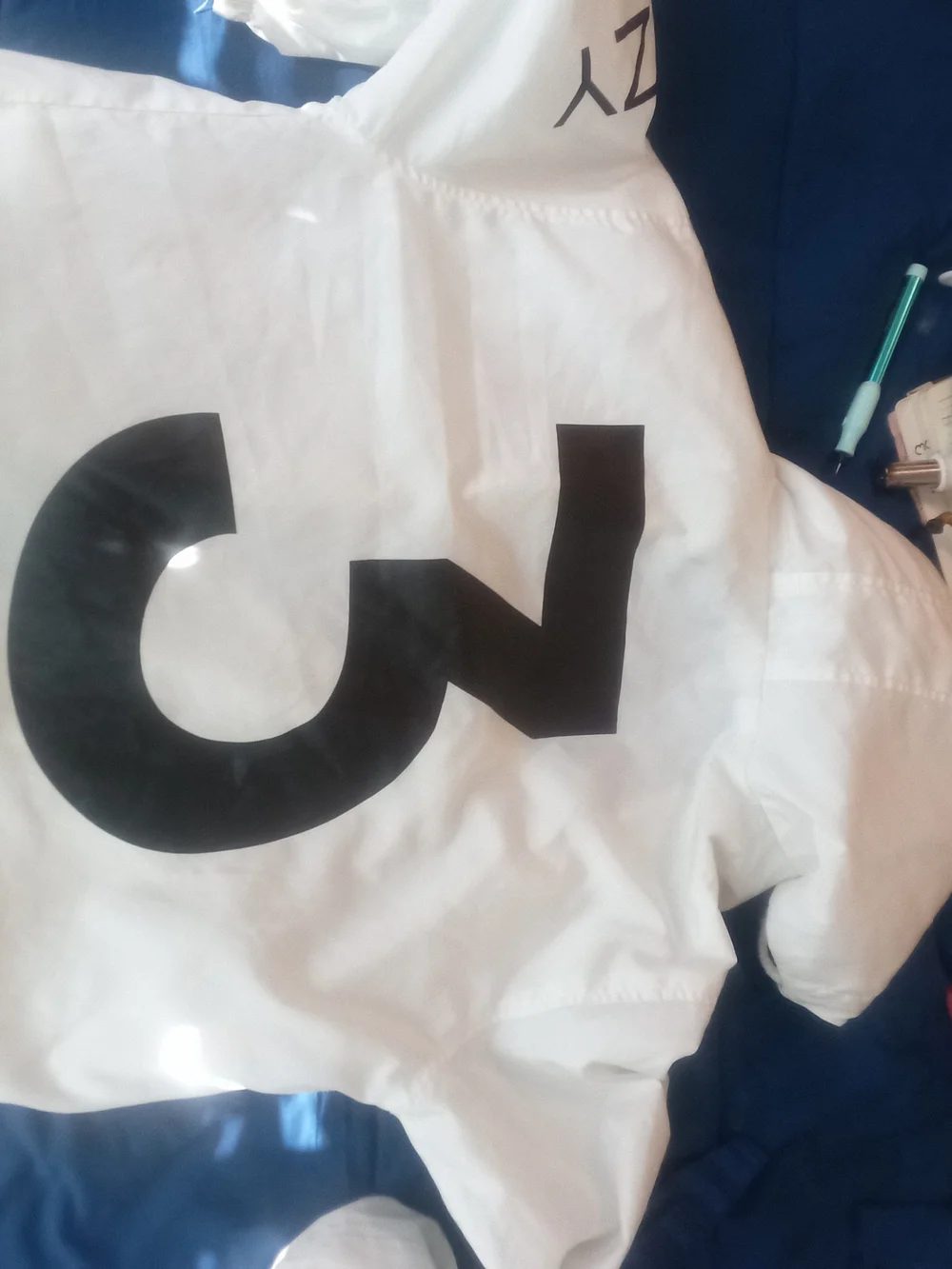 adidas Large Yeezy Yeezus Tour White Windbreaker Jacket with Black Text Branding